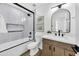 Modern bathroom with a bathtub, vanity, and stylish mirror at 1914 E Golden Ct, Chandler, AZ 85225