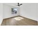 Bright bedroom with wood-look flooring and ceiling fan at 1914 E Golden Ct, Chandler, AZ 85225