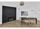 Modern dining room with dark wood table and fireplace at 1914 E Golden Ct, Chandler, AZ 85225