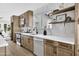 Modern kitchen with wood cabinets, stainless steel appliances, and quartz countertops at 1914 E Golden Ct, Chandler, AZ 85225