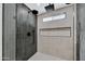 Large walk-in shower with gray tile and dual shower heads at 1914 E Golden Ct, Chandler, AZ 85225