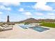 Luxury pool and spa with mountain views, fire pit, and lounge chairs at 20646 N 112Th St, Scottsdale, AZ 85255