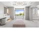 Modern bathroom featuring a freestanding tub and large window at 20646 N 112Th St, Scottsdale, AZ 85255