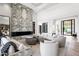 Elegant living room with a statement marble fireplace and ample seating at 20646 N 112Th St, Scottsdale, AZ 85255