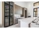 Modern wet bar with glass-front cabinetry, marble countertops, and sleek design at 20646 N 112Th St, Scottsdale, AZ 85255