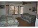 Bedroom with two twin beds, ceiling fan and large windows at 2425 E Durango Dr, Casa Grande, AZ 85194