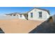 Spacious backyard with gravel and a view of the home's back at 25570 N 154Th Ln, Surprise, AZ 85387