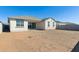 Large backyard with gravel and a view of the home's back at 25570 N 154Th Ln, Surprise, AZ 85387