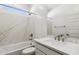 Clean bathroom with marble-look walls, a bathtub, and modern vanity at 25570 N 154Th Ln, Surprise, AZ 85387