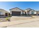 New construction home with desert landscaping and a two-car garage at 25570 N 154Th Ln, Surprise, AZ 85387