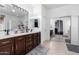 Bathroom boasts double sinks and a large mirror at 25822 W Magnolia St, Buckeye, AZ 85326