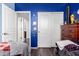 Bedroom with twin beds and blue walls at 25822 W Magnolia St, Buckeye, AZ 85326