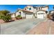 Two-story house with a double garage and driveway at 25822 W Magnolia St, Buckeye, AZ 85326