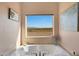 Bathroom with soaking tub and mountain views at 2837 N Whiting Cir, Mesa, AZ 85213