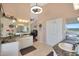 Double vanity bathroom with marble counters and walk-in closet at 2837 N Whiting Cir, Mesa, AZ 85213