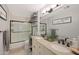 Elegant bathroom with double vanity, a large mirror, and a shower/tub combo at 2837 N Whiting Cir, Mesa, AZ 85213