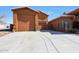 View of a two-car garage and part of a house at 2837 N Whiting Cir, Mesa, AZ 85213