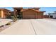 Two-story house with three-car garage and landscaped front yard at 2837 N Whiting Cir, Mesa, AZ 85213