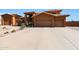 Two-story house with a large driveway and desert landscaping at 2837 N Whiting Cir, Mesa, AZ 85213