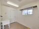 Bright laundry room with utility sink and shelving at 2837 N Whiting Cir, Mesa, AZ 85213