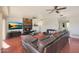 Relaxing living room featuring a fireplace and large TV at 2837 N Whiting Cir, Mesa, AZ 85213