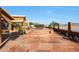 Large patio with fire pit and tiered seating at 2837 N Whiting Cir, Mesa, AZ 85213