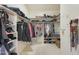 Large walk-in closet with shelving and hanging rods at 2837 N Whiting Cir, Mesa, AZ 85213