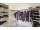 Well-organized walk-in closet with double hanging rods and shelving at 2837 N Whiting Cir, Mesa, AZ 85213