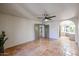 Bedroom with terracotta tile floors and ceiling fan at 3013 W Phelps Rd, Phoenix, AZ 85053