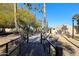 Community footbridge with lush landscaping and trees at 3013 W Phelps Rd, Phoenix, AZ 85053