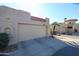 Attached garage with single door and stucco exterior at 3013 W Phelps Rd, Phoenix, AZ 85053