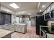 Galley kitchen with stainless steel appliances at 3013 W Phelps Rd, Phoenix, AZ 85053