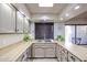 Kitchen with light wood cabinets and stainless steel sink at 3013 W Phelps Rd, Phoenix, AZ 85053