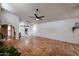 Open living area with tile floors and sliding barn door at 3013 W Phelps Rd, Phoenix, AZ 85053