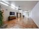 Living room with tile floors, fireplace and tv at 3013 W Phelps Rd, Phoenix, AZ 85053