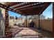 Relaxing patio area with pergola, seating, and grill at 3013 W Phelps Rd, Phoenix, AZ 85053