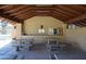 Relaxing poolside space with covered picnic tables at 3013 W Phelps Rd, Phoenix, AZ 85053