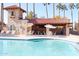 Community pool with covered patio and tables at 3013 W Phelps Rd, Phoenix, AZ 85053