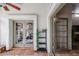 Sunroom with French doors opening to a patio and a ceiling fan at 3013 W Phelps Rd, Phoenix, AZ 85053