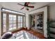 Sunroom with tile flooring, ceiling fan, and French doors at 3013 W Phelps Rd, Phoenix, AZ 85053