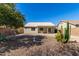 View of backyard with gravel, cactus, and bird bath at 30573 N Royal Oak Way, San Tan Valley, AZ 85143