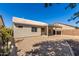 Desert landscaping surrounds this home's covered patio and spacious backyard at 30573 N Royal Oak Way, San Tan Valley, AZ 85143