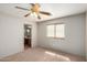 Well-lit bedroom with carpet flooring and ceiling fan at 30573 N Royal Oak Way, San Tan Valley, AZ 85143