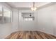 Dining area with wood-look floors and open view to living area at 30573 N Royal Oak Way, San Tan Valley, AZ 85143