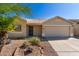 Single-story house with a two-car garage and desert landscaping at 30573 N Royal Oak Way, San Tan Valley, AZ 85143