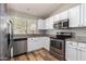 Modern kitchen featuring stainless steel appliances and granite countertops at 30573 N Royal Oak Way, San Tan Valley, AZ 85143