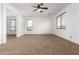 Bright bedroom with neutral carpeting and ceiling fan at 30773 N 129Th Ave, Peoria, AZ 85383