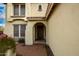 Elegant entryway with arched doorway and brick pathway at 30773 N 129Th Ave, Peoria, AZ 85383