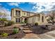 Two-story house with tile roof, stone accents, and a landscaped front yard at 30773 N 129Th Ave, Peoria, AZ 85383