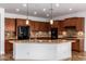 Kitchen boasts granite countertops, island, and ample cabinetry at 30773 N 129Th Ave, Peoria, AZ 85383